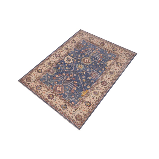 Enhance your home with this exquisite hand-knotted Kazak rug, crafted from fine hand-spun wool and dyed with all-natural...