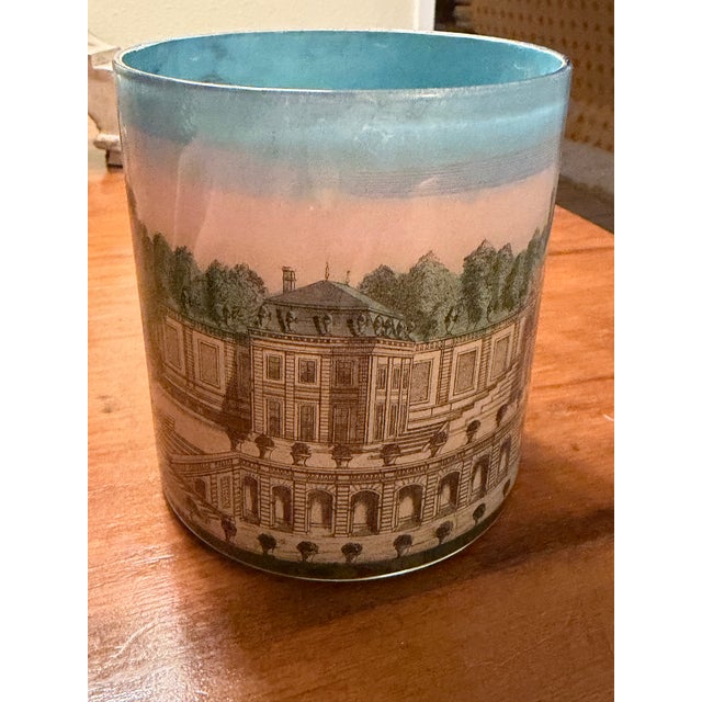 Beautiful pinks, blues and greens make up this reverse decoupage desk cup — depicting the grandest estate of all.