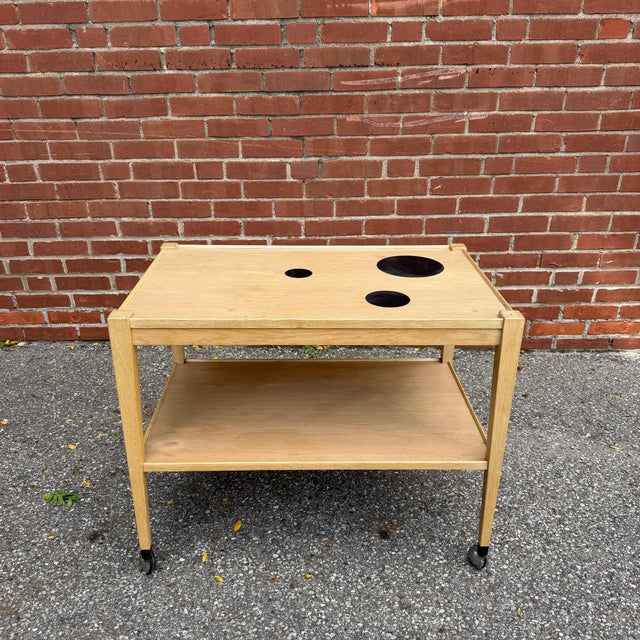 Made in Denmark by Thams Kvalitet, this mahogany bar cart pairs clean Scandinavian design with everyday function. The...