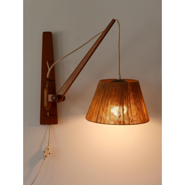 Rare and elegant Mid-Century Modern swing wall light. Adjustable vertical and horizontal. Designed & manufactured in...