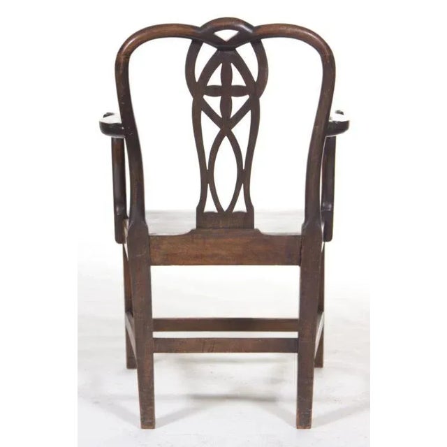 A handsome pair of provincial English mahogany Chippendale arm chairs made in the 18th century. (see 2 pair of matching...