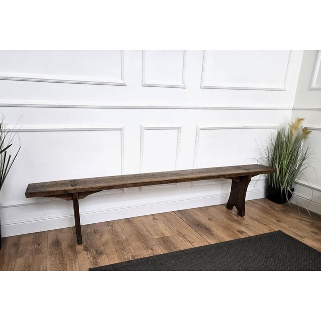 Beautiful Italian rustic primitive country wooden bench, with trestle style legs in original aged natural color giving the...
