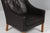 Børge Mogensen wingback chair in original Black leather upholstery. Legs in oak. Model 2204, made by Fredericia Furniture....