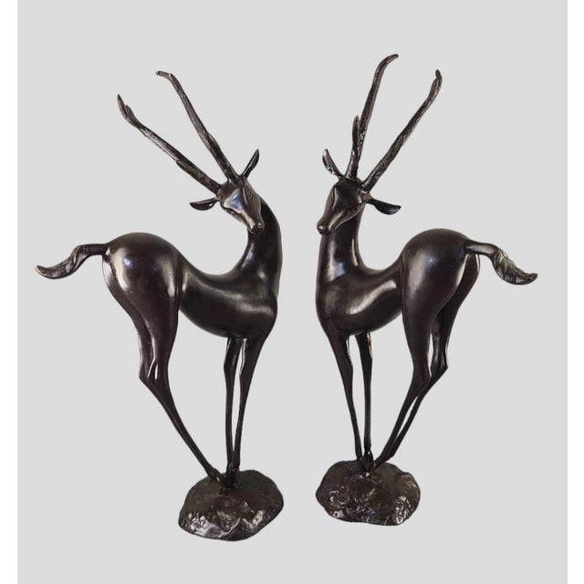 We are pleased to be offering this stunning mid-century modern pair of bronze sculptures depicting graceful Antelope deer...