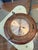 Vintage nautical porthole ship clock. Has brass port hole trim and carved wood. Diameter: 14”