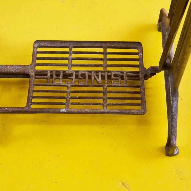 Discover a piece of history with this charming vintage sewing machine. Featuring an elegant design, the machine is mounted...