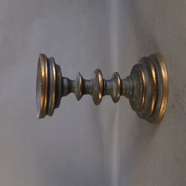 This heavy candle stick is made from brass.