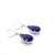 These colorful earrings feature two bright pear shape treated tanzanites weighing approximately 25.35 carats total...