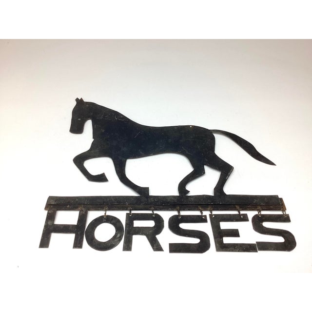 Antique Folk Art Hand Cut Sheet Metal Horses A trotting horse above the word “HORSES.” Cut from heavy sheet metal with a...