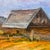 A vintage pastoral landscape depicting a rustic barn set beneath a softly layered sky. Expressive brushwork and a...