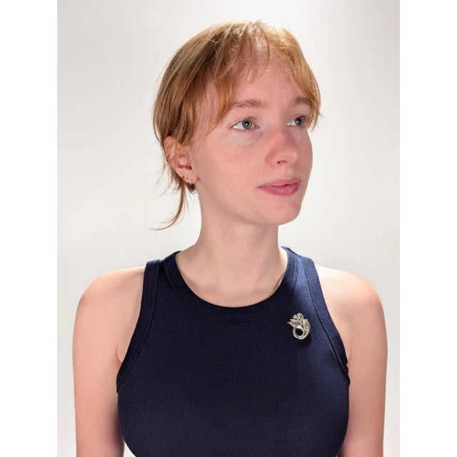 A fine Georg Jensen sterling silver pin or brooch. Model no. 100A. Designed by Georg Jensen. In the form of a hand-...