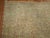A highly decorative floral Persian rug with a formal presence. Caramel ground with hints of soft blues, raspberries,...