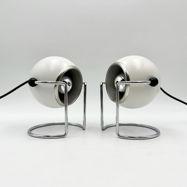 This rare vintage pair of Targetti Sankey eyeball lamps is a striking example of Italian Space Age design from the 1970s....