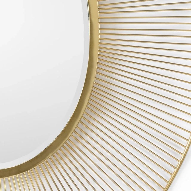 Add dimension and warmth to your home with Luton Mirror. This abstract sunburst design has a plated brass finish on an...