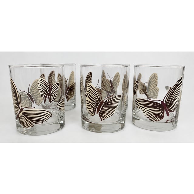 Set of six vintage Edgar Watkins rocks glasses featuring an all-over butterfly pattern in rich brown and soft cream on...