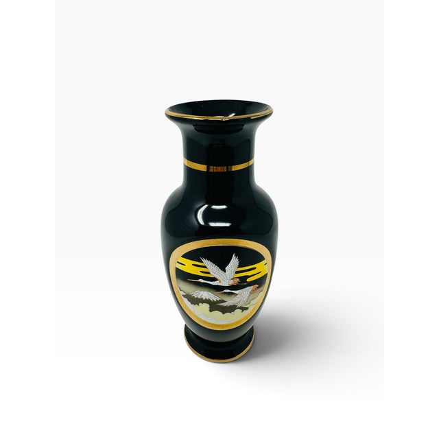 Add a touch of elegant mid-century Japanese artistry to your space with this striking 1980s vintage porcelain vase from...