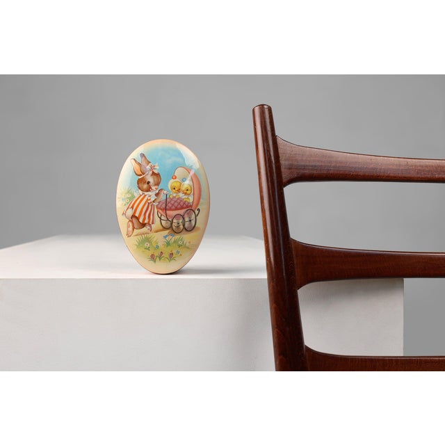A charming Belgian tin can from around 1930, blending early Art Deco decorative geometry with the playful, colourful...