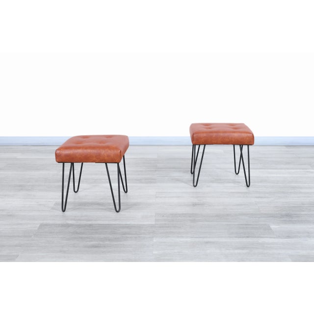 This exceptional pair of vintage leather and iron stools, crafted in the United States during the 1950s, perfectly...