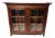 Antique English Oak Glass Door Bookcase Cabinet With Wavy Apron & Oversized Cornice For Sale