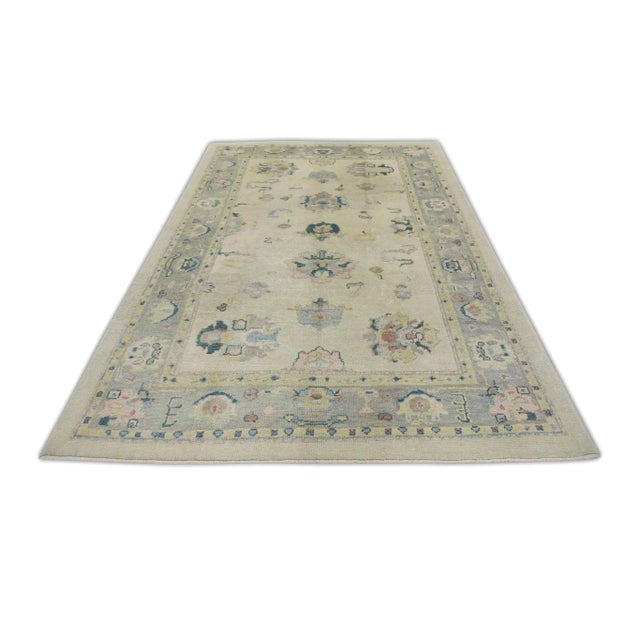 Early 21st Century Cream Handwoven Wool Turkish Oushak Rug in Pink & Blue Floral Design 6'1" X 9'1" For Sale In Houston - Image 6 of 7