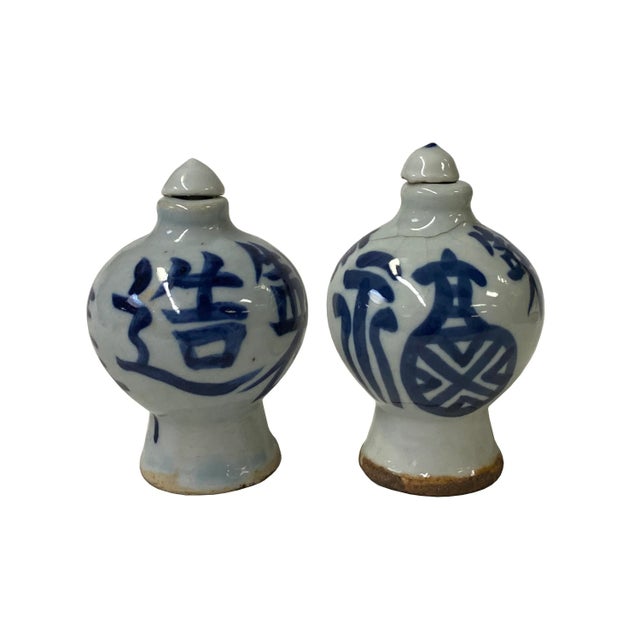 These two Chinese snuff bottles are made of porcelain, the surface is hand-painted with blue white characters graphics....