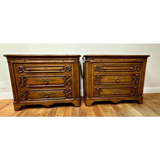 An elegant pair of French Regency-style nightstands by Karges Furniture, beautifully crafted in richly figured mahogany...