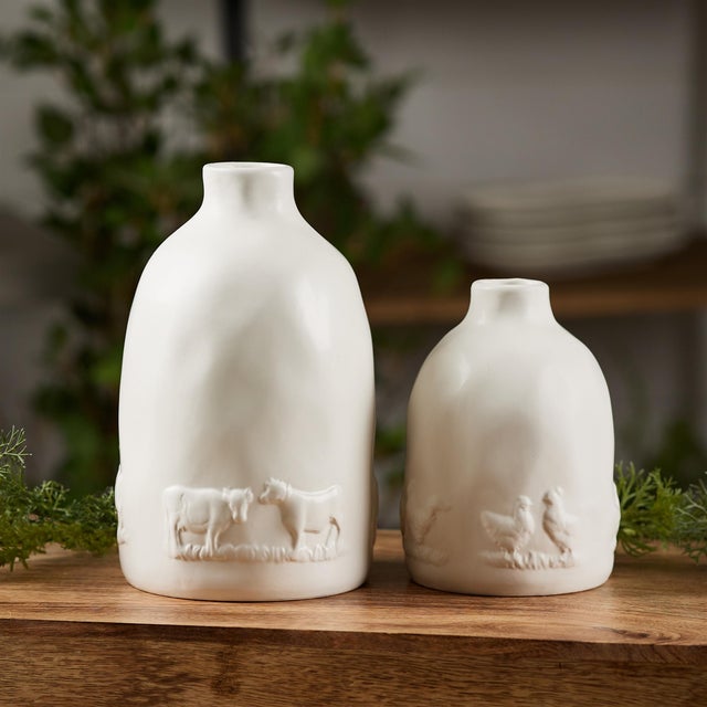 Bring a charming rustic vibe to your space with this delightful set of Ceramic Farm Animal Vases. Featuring a clean white...