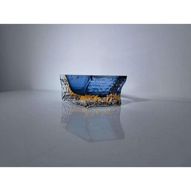 Mandruzzato sommerso glass ashtray, vintage from the 1970s; its sculptural shape and vibrant colors, a deep blue and...