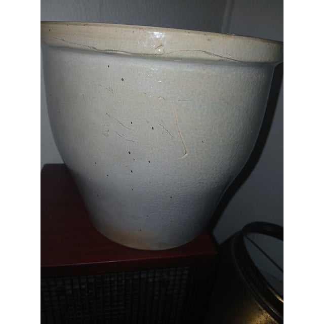 Antique 1-gallon stoneware crock with a rich, aged glaze. Ideal for farmhouse, rustic or french country decor, it works...