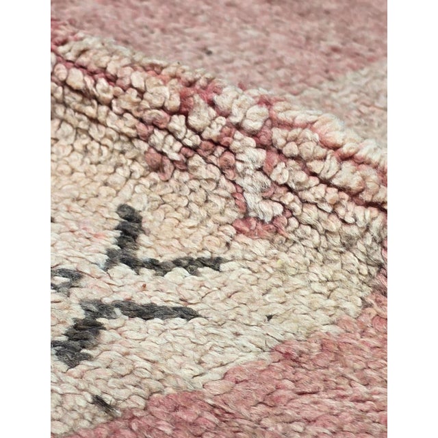 Vintage Rose Pink Moroccan Rug | Handwoven Berber Wool Rug with Diamond Medallions This vintage Moroccan rug features a...
