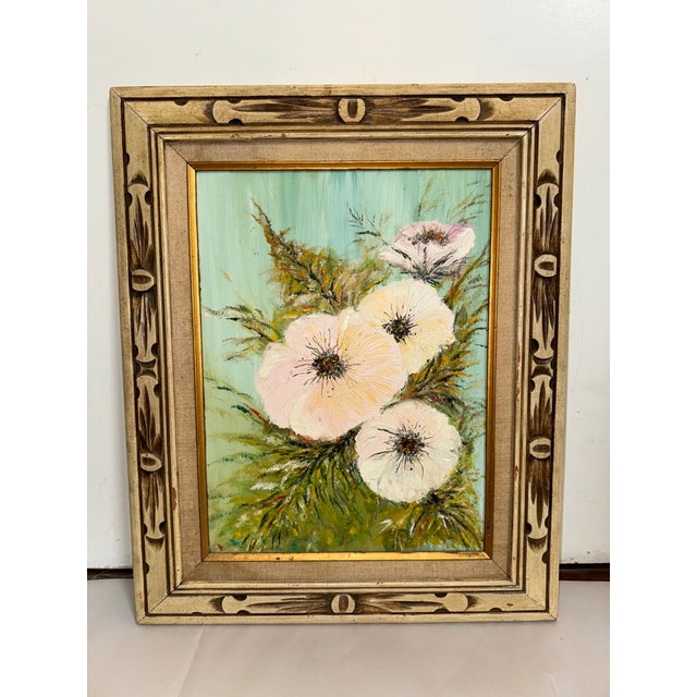 This listing for a mid century painting. This oil on canvas painting depicts tropical flowers with a blue background. It...