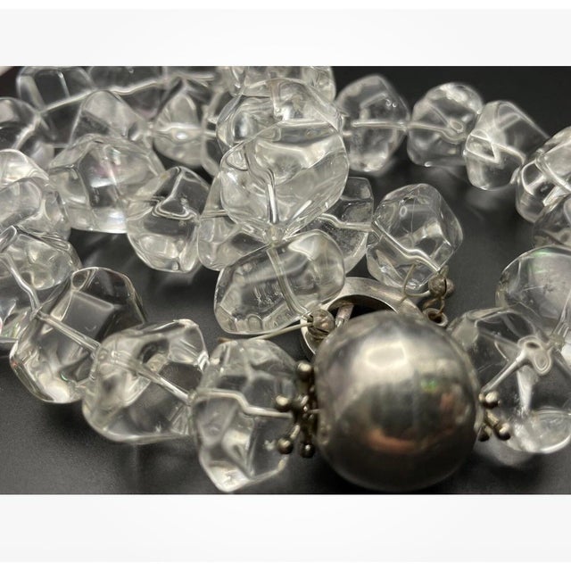 Incredibly clear rock crystal clear quartz . The item is 19" long. It has a large sterling clasp, and a single large...