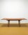 A vintage Danish teak extendable table from the 1960s with an elegant rectangular design and extension system, perfect for...