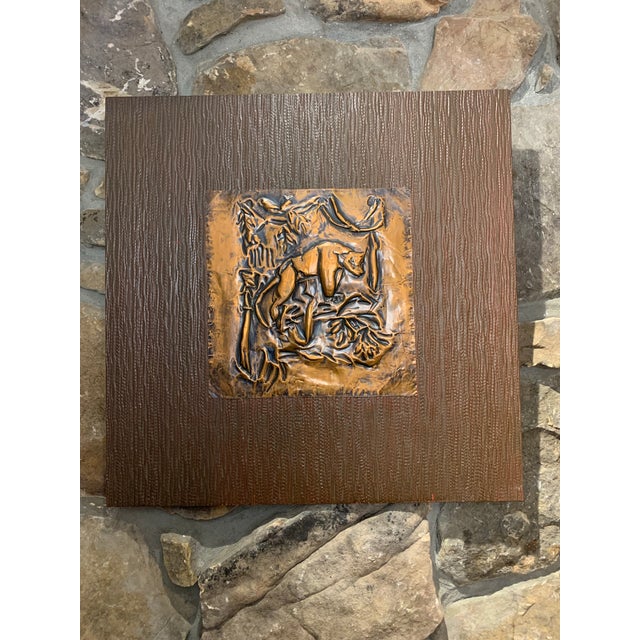 This pair of mid century wall panels feature a copper toned panther motif executed in the repoussé technique. The metal...