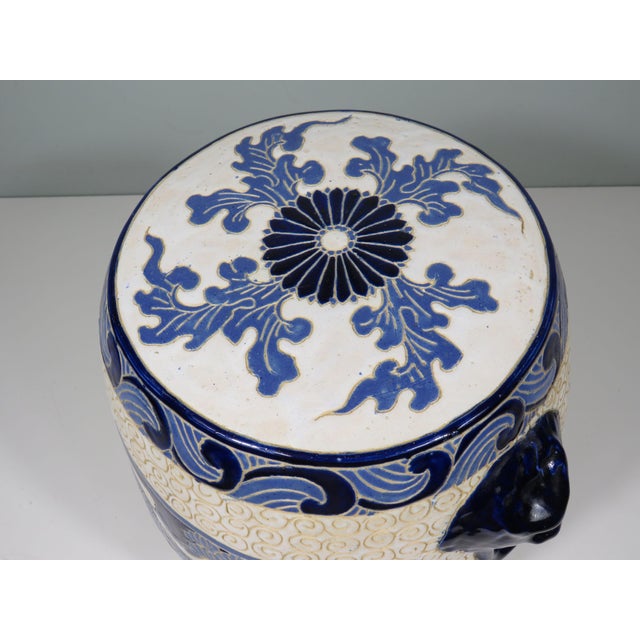 This ceramic barrel-shaped stool is a true work of art full of symbolism and refined detail. The decoration shows a serene...