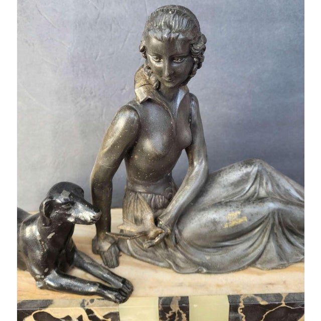 I’m selling a vintage or antique (ca. 1920’s/30’s) Art Deco period figural sculpture of a seated woman wearing a flowy...