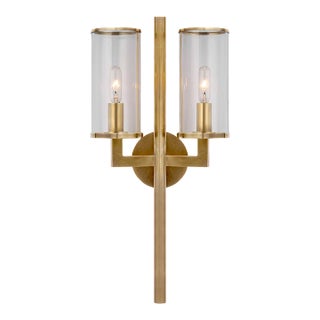 Kelly Wearstler for Visual Comfort Signature Liaison Double Sconce in Antique-Burnished Brass with Clear Glass For Sale