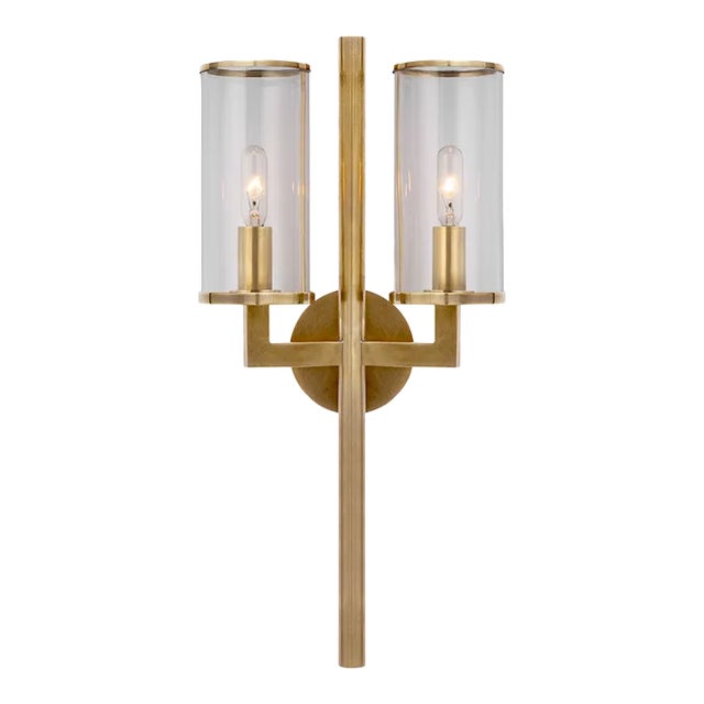 Kelly Wearstler for Visual Comfort Signature Liaison Double Sconce in Antique-Burnished Brass with Clear Glass For Sale