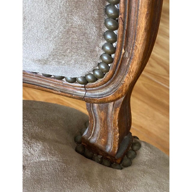 Classic French Walnut side chairs. Each chair is carved from solid walnut. The chairs are currently sporting a suede type...