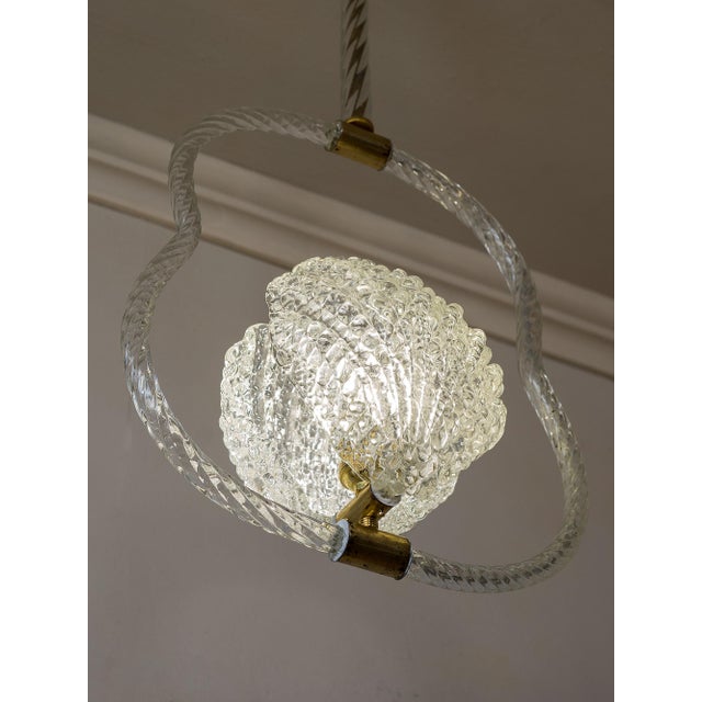 This art deco chandelier, dating back to the 1930s, was crafted by the prestigious venetian glassworks barovier & toso....