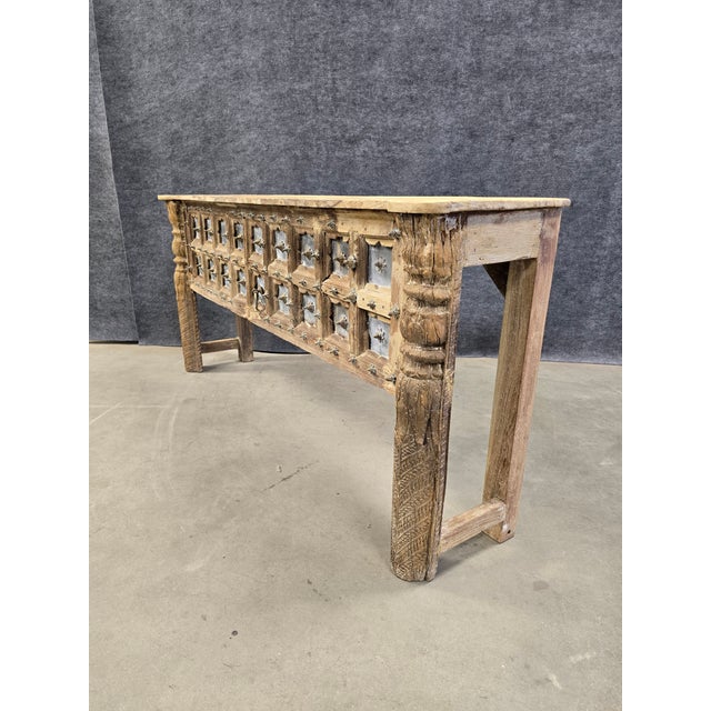 Elevate your entryway or living space with this extraordinary hand-carved console table. A true conversation piece, this...