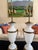 A magnificent pair of urn style table lamps in white opaline with bronze accents and handles. These tall lamps were...