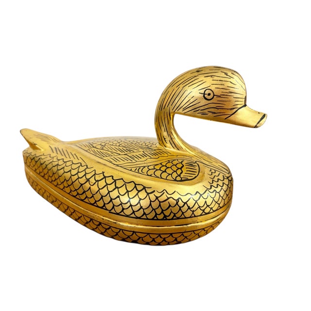 This charming Burmese trinket box showcases traditional lacquerware craftsmanship, featuring a duck form adorned with gold...
