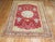An early 20th century Turkish Oushak rug. 4 teapots on a rich cherry color field, accents in lime green, gray , and orange...