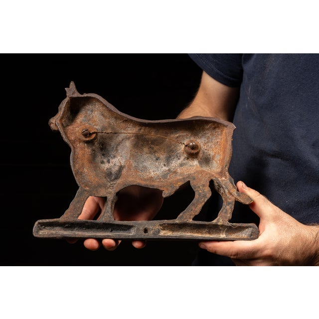 Early 20th-century cast iron bull finial originally intended to crown a butcher shop display rack or similar commercial...