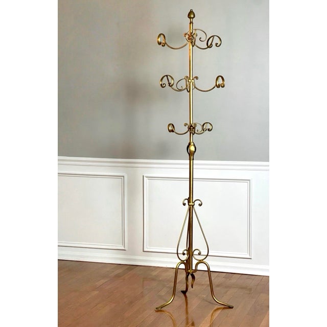 Three-tier revolving gilt wrought iron hall tree coat stand and hat rack in the manner of Hans Koegl, Italy, 1950s. A...
