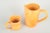 Kähler, Denmark Two large pitchers, 1930s. Two large hand-thrown ceramic pitchers in Kähler’s characteristic yellow-orange...