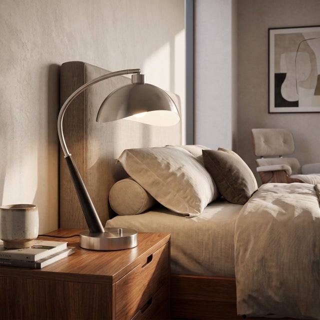 Featuring a striking boomerang silhouette, the Luna Bella Boomerang Table Lamp is a contemporary table lamp with a black...