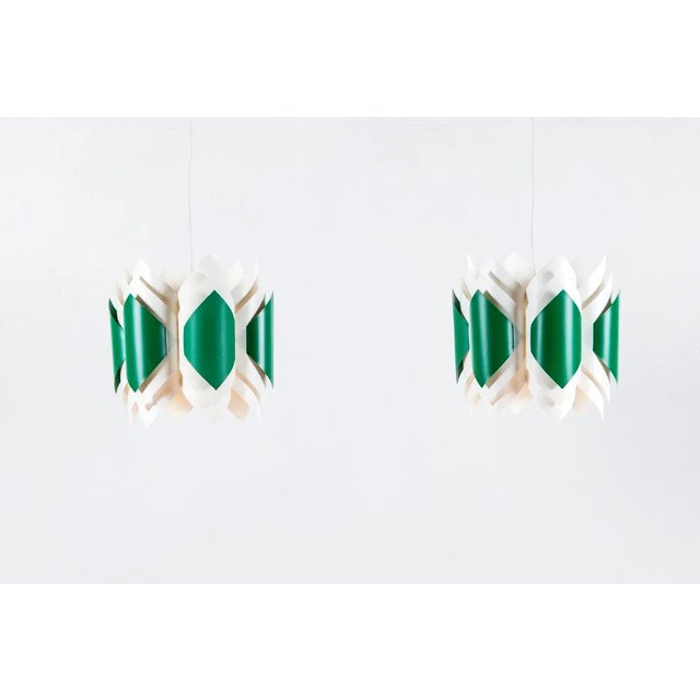 These pendant lamps, design by Lars Schiøler for Hoyrup in Denmark, are made of shades in green and white acrylic. I have...
