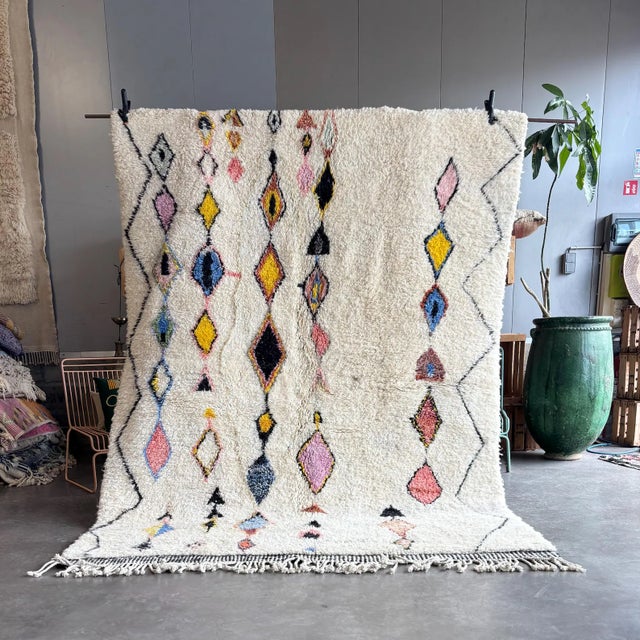 Bring timeless elegance into your home with this Moroccan Mrirt wool rug, handcrafted by skilled Berber artisans from the...